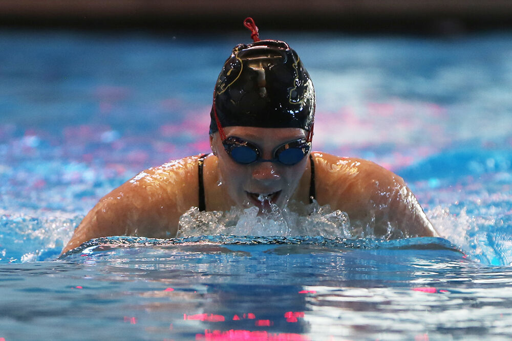 Makenna Lambert takes a breath during the breast stroke section